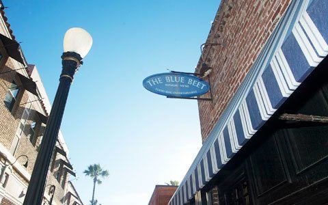The Blue Beet oval sign on the brick building